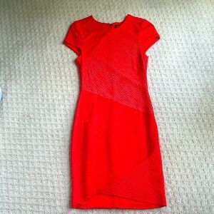 Red dress by Torn by Ronny Kobo. Size 0. Asymmetrical pattern.